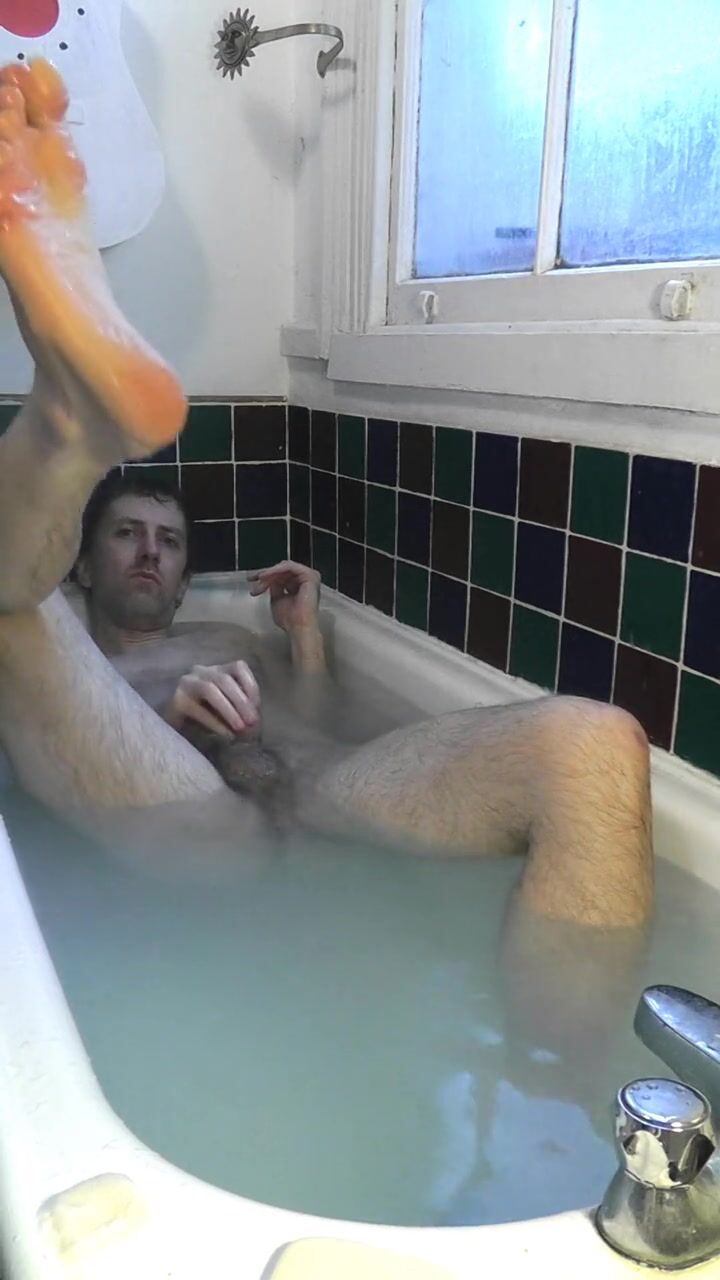 Nude men in bathtub
