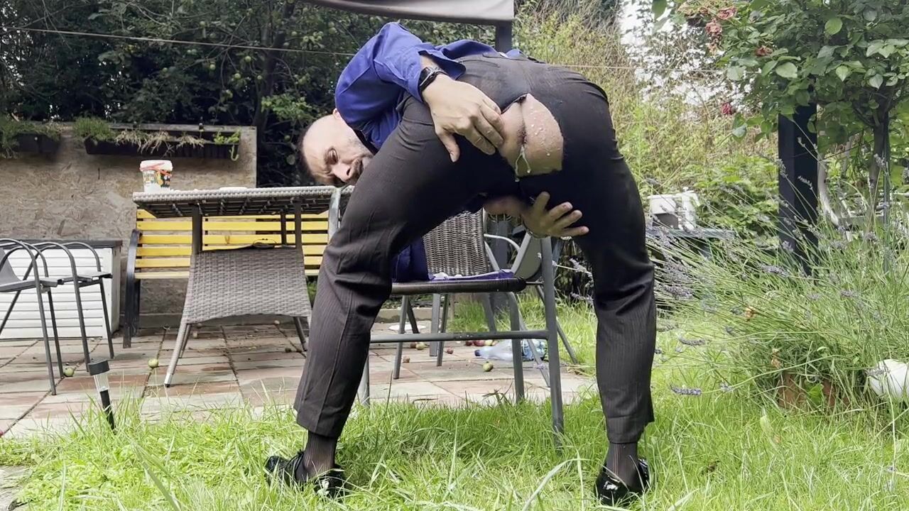 Suited men with locked dick is playing with his mancunt and pissing in public in sheer socks watch online photo