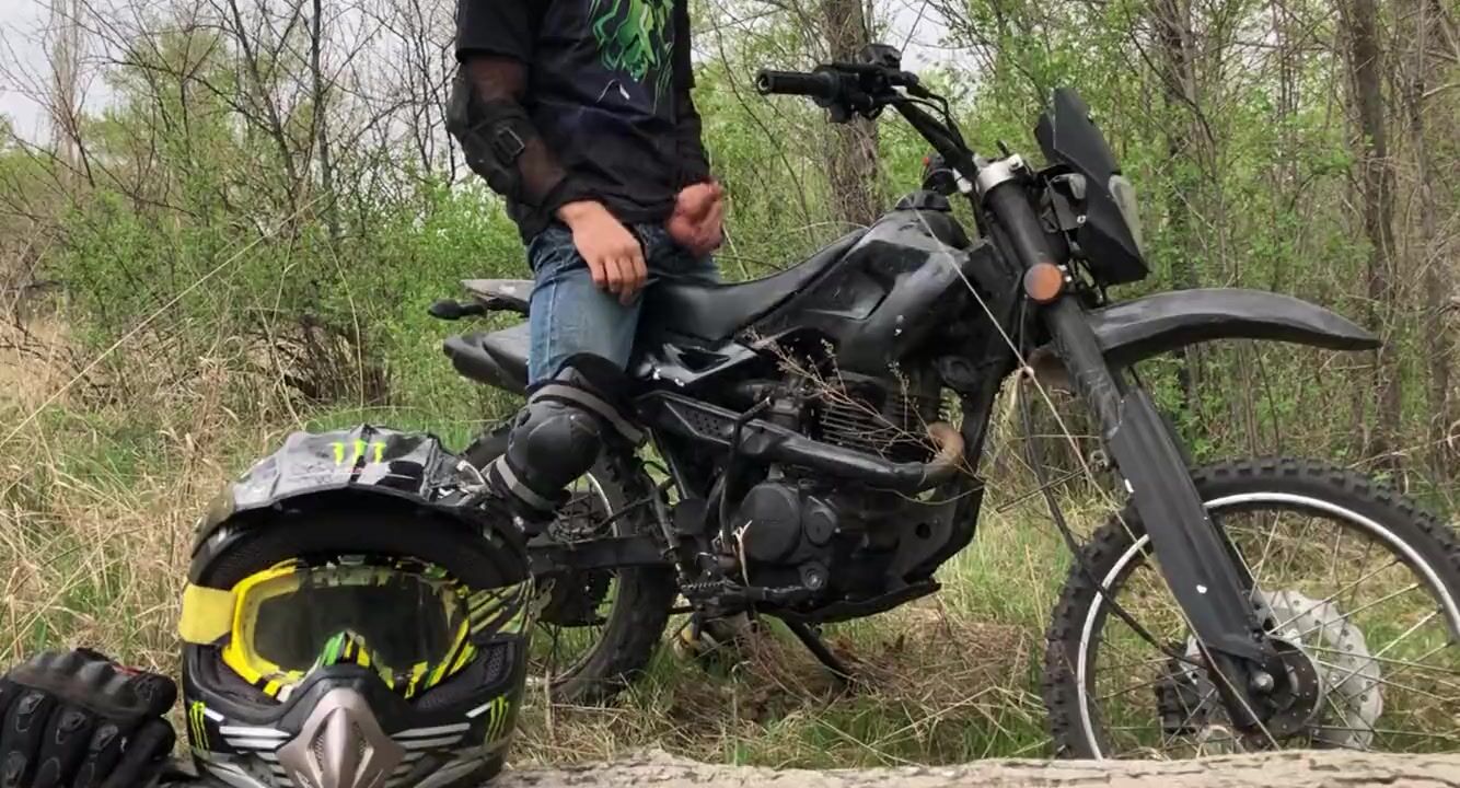Handsome BIKER while riding a MOTORCYCLE in the forest JERKS OFF and CUMS in public watch online pic